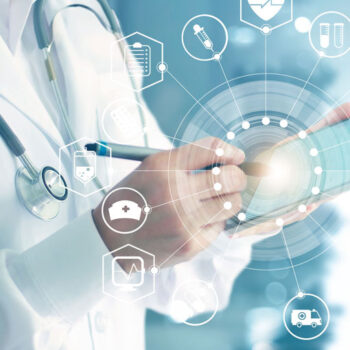 Highly-Specialised-Services Doctor in whites holding a tablet device